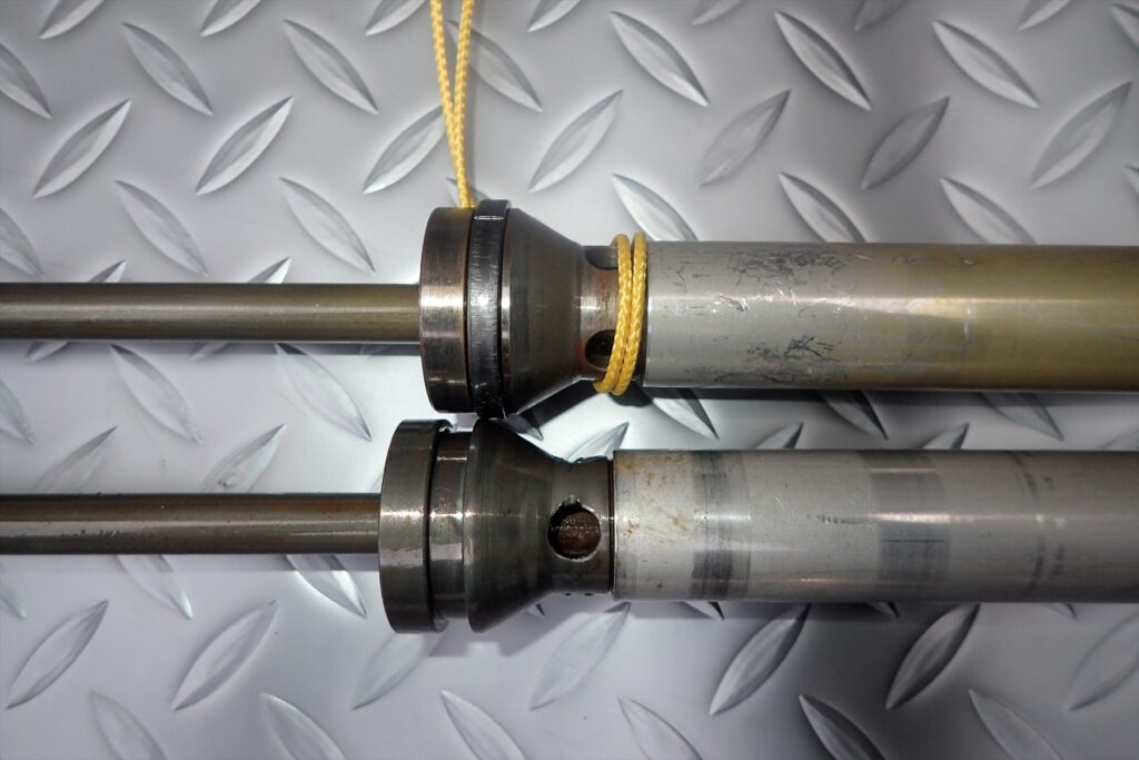 Close-up view of the top joints of motorcycle fork cylinders for MD30 and ME08.
