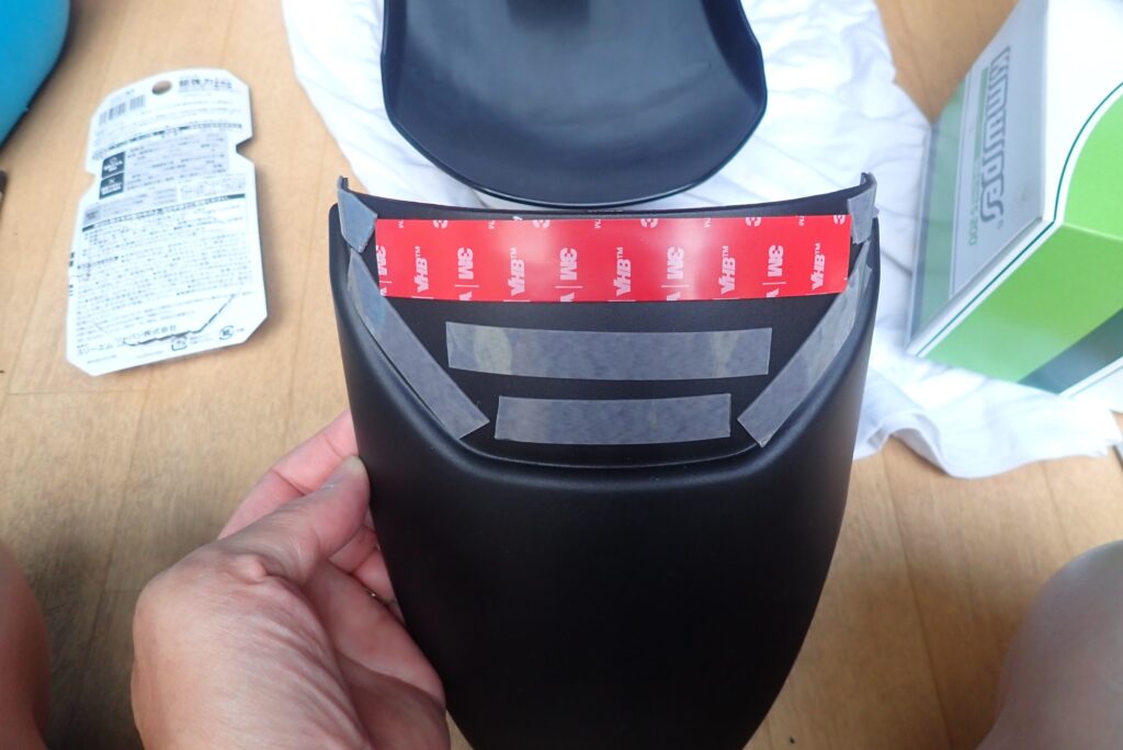 Strong 3M double-sided adhesive tape applied to the inner attaching surface of the plastic fender extender flap.