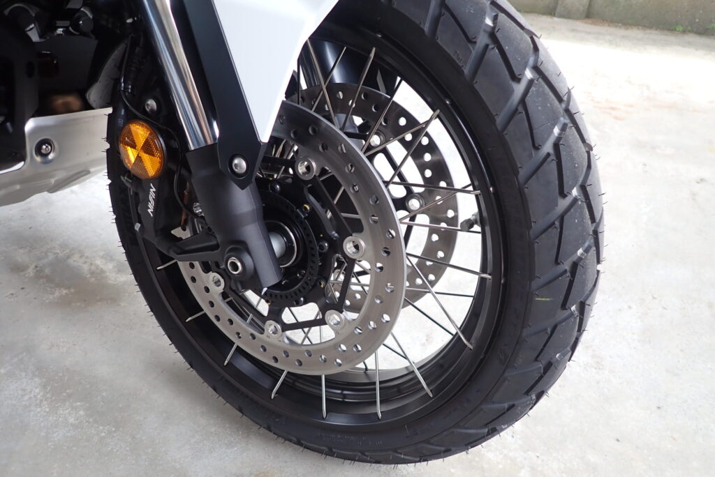 Front view of the 17-inch tubeless spoke wheel on a Honda X-ADV 750 motorcycle.
