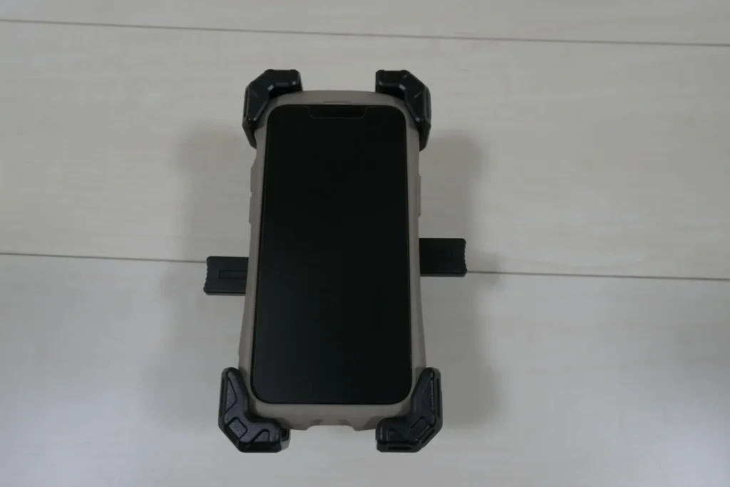 An iPhone 13 mini in a case fitted to the KDR-M11CPJ