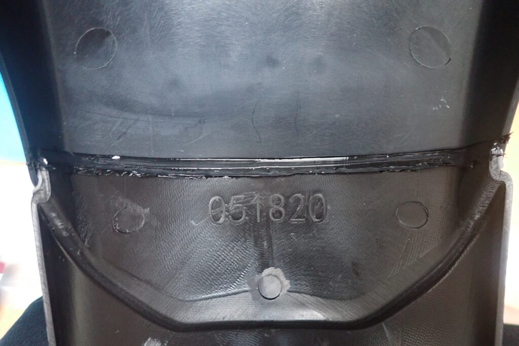 The inner joint between the motorcycle fender and extender completely sealed and waterproofed with black silicone caulk to prevent dirt entry.