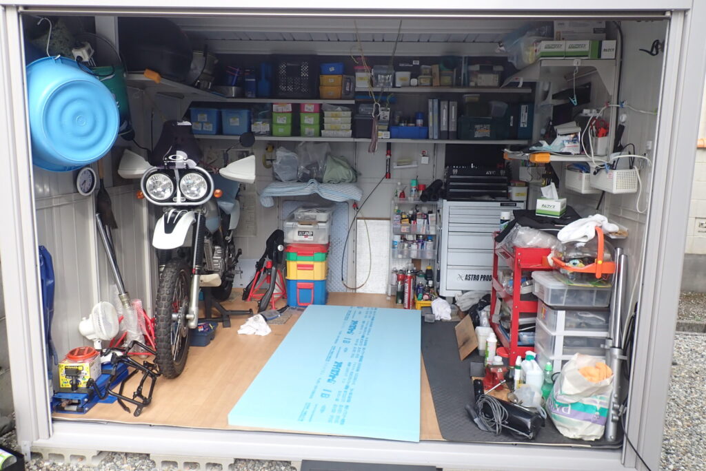 Inside the garage, before starting to cut the light blue Styrofoam.