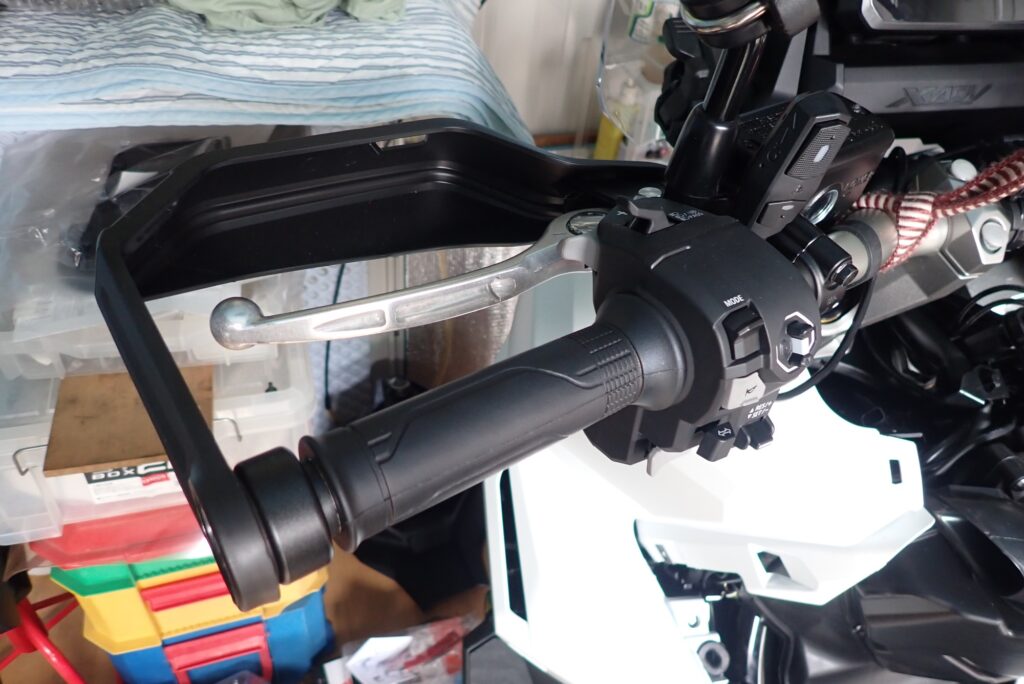 Close-up of the left-hand rear brake lever on the handlebar.