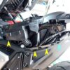 Side view of the exposed Honda X-ADV rear subframe showing grommet ports and sliding slot holes after removing the body panel.