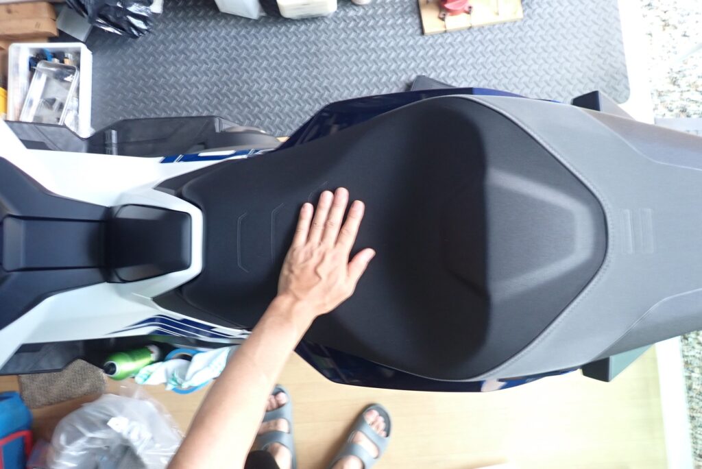 Overhead view of the broad stepped rider seat on a Honda X-ADV designed for long-distance touring comfort.