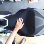 Overhead view of the broad stepped rider seat on a Honda X-ADV designed for long-distance touring comfort.