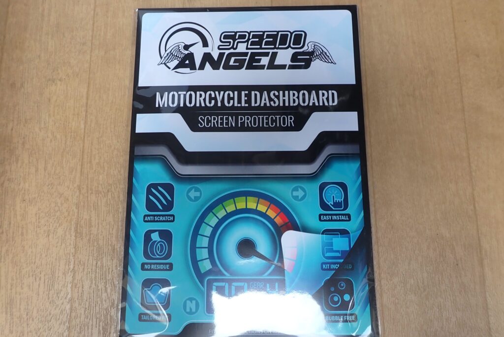 Front retail packaging of Speedo Angels motorcycle dashboard screen protector kit for Honda high-definition TFT displays.