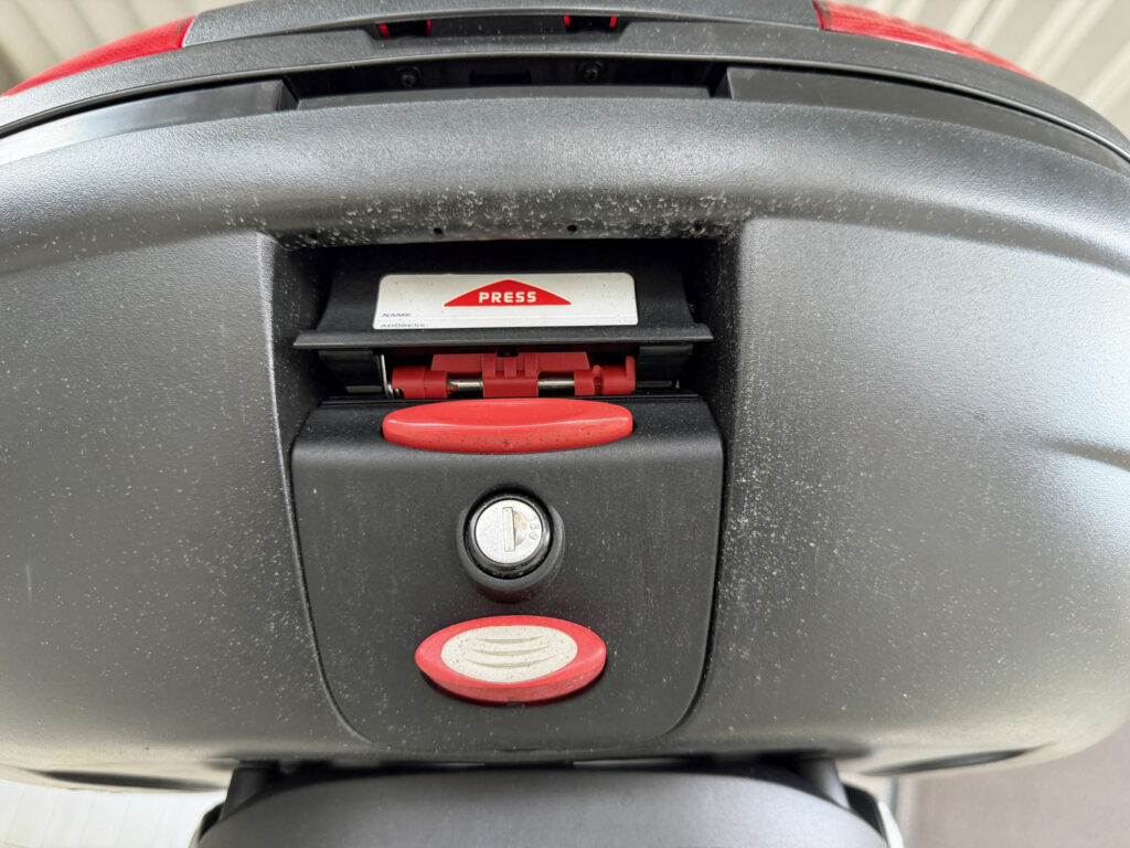 Bottom surface of GIVI top case showing only fine mist dirt after 400km test ride