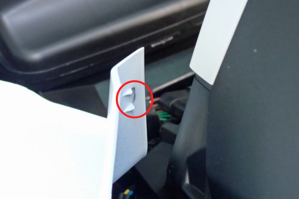 Red circle highlighting the broken plastic tab stem on the inner edge of the Honda X-ADV left side fairing.