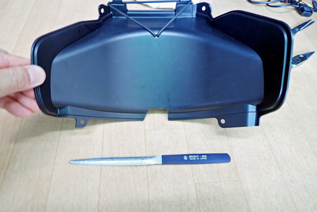 Honda X-ADV battery cover custom notched using rotary grinder and Bright-900 file