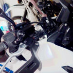 Completed installation of front dashcam camera neatly tucked under Honda X-ADV right mirror