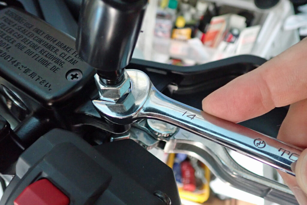 14mm open-end wrench placed on Honda X-ADV right rearview mirror nut