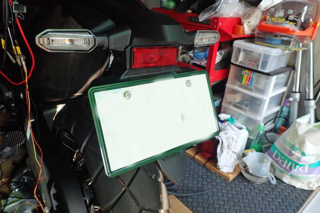 Honda X-ADV genuine rear license plate before dashcam installation