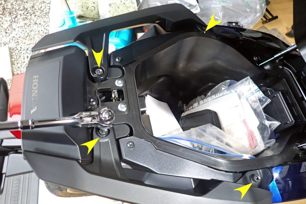 Removing stock grab bar bolts on Honda X-ADV motorcycle