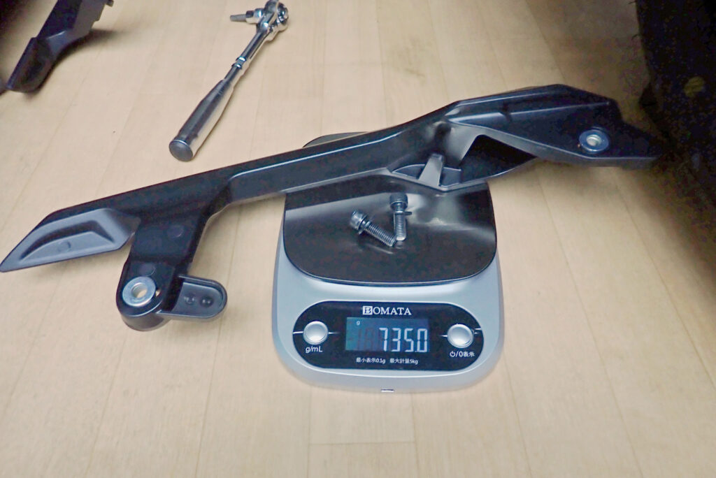 Measuring weight of Honda X-ADV stock grab bar on digital scale