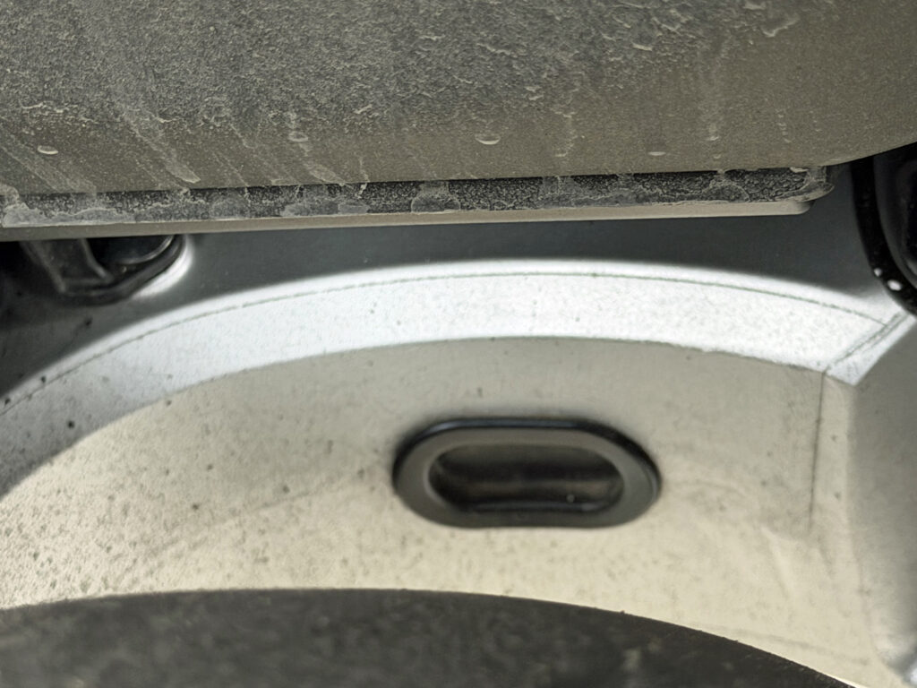 Clean condition of Honda X-ADV swingarm showing only fine mist with no coarse gravel