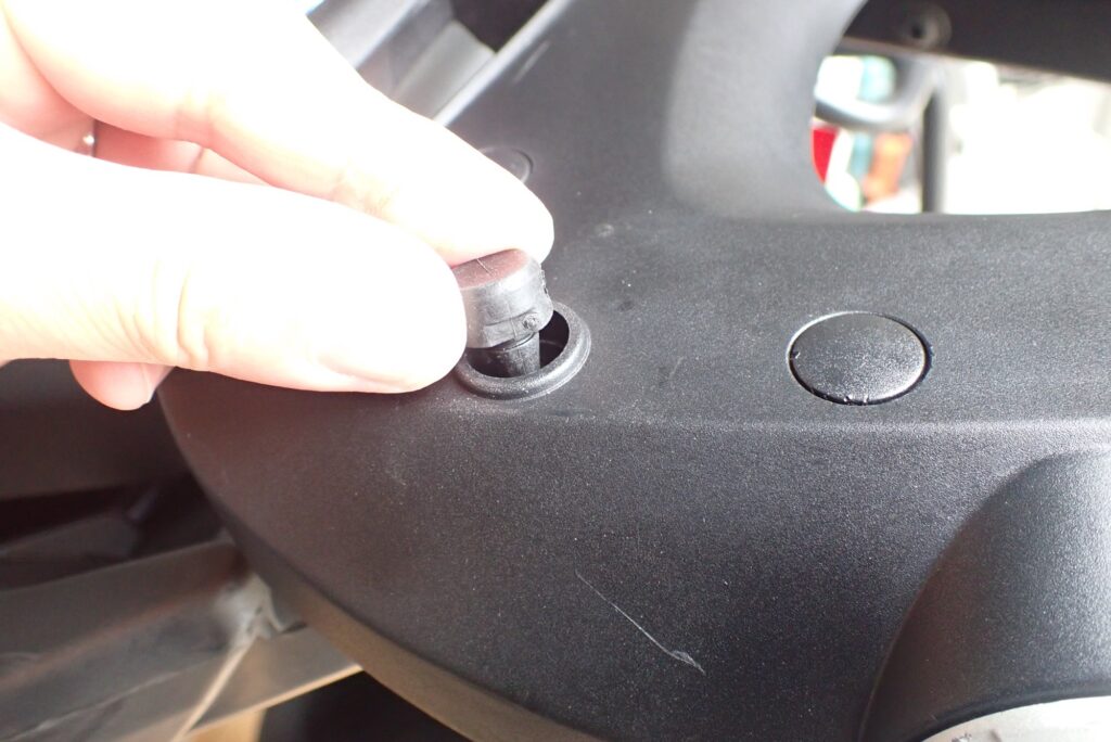 Inserting new GIVI rubber damper into baseplate hole by hand