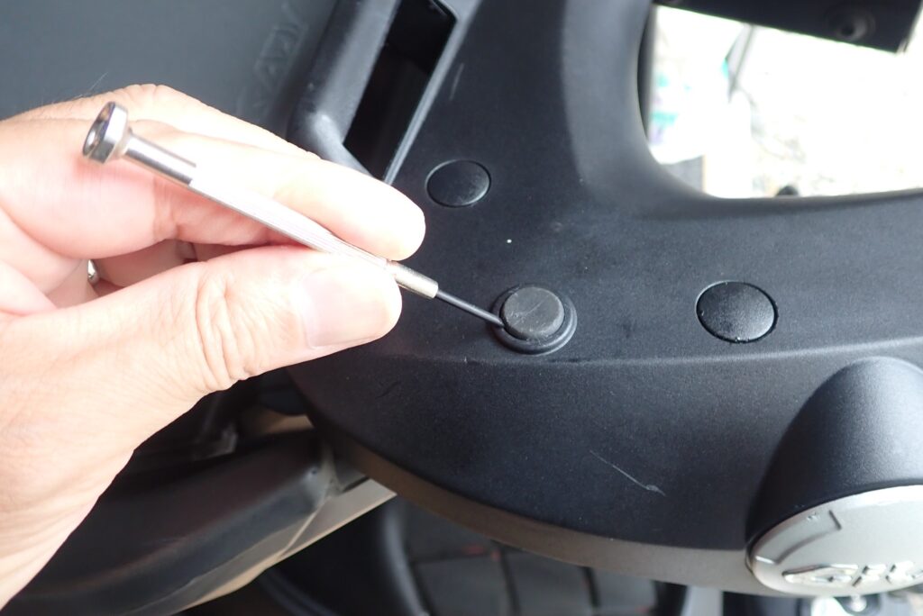 Removing old GIVI baseplate rubber damper using a precision screwdriver