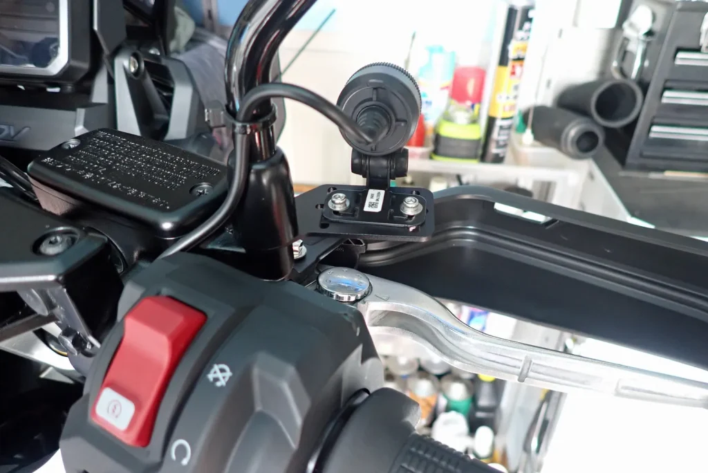 Rear perspective of front camera mount on Honda X-ADV handlebar