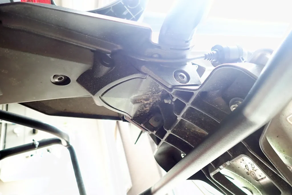 Overview of rear camera cable routing along the motorcycle tail section