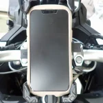 iPhone 13 mini with rugged hybrid case held securely in Kaedear mount