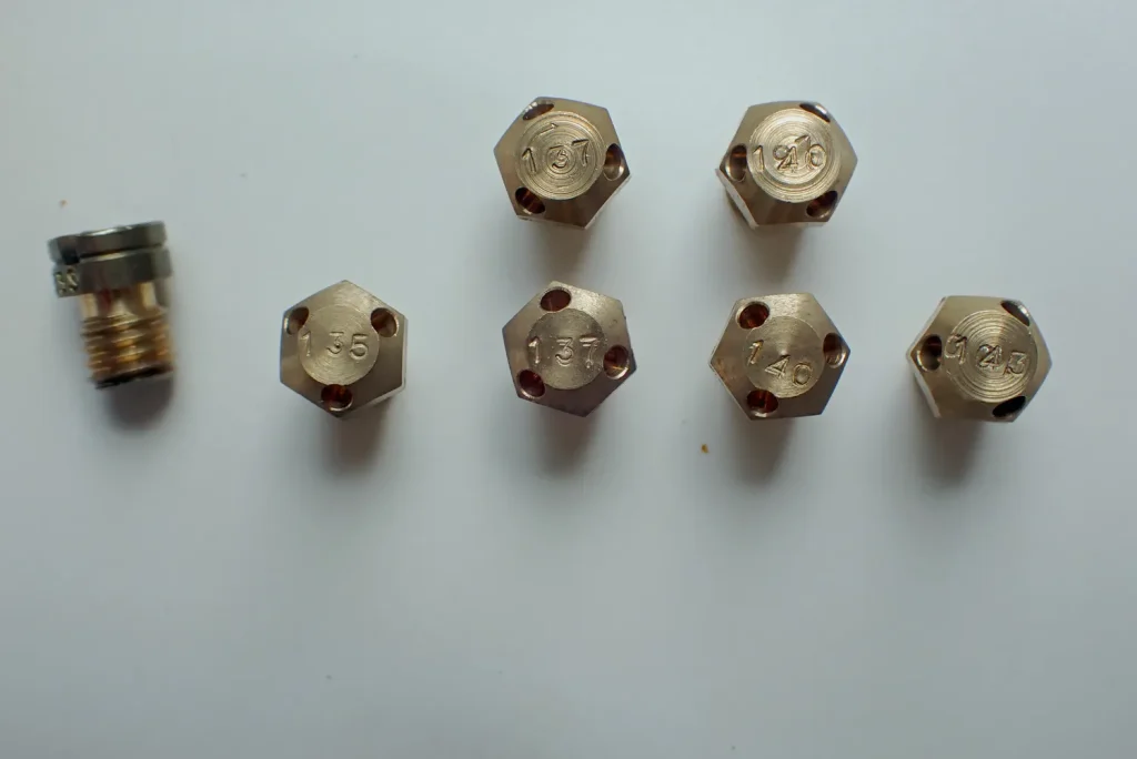Set of KENSO Bakudan main jets showing stamped numbers 135 to 143