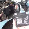 Discharged YTX5L-BS 12V motorcycle battery completely removed from the frame