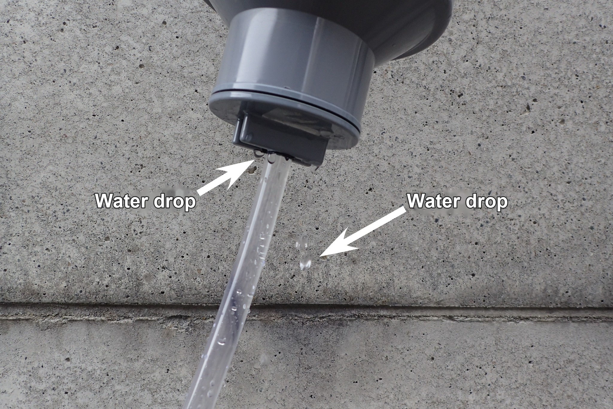 Water dripping from the joint between the PVC pipe and the clear hose.