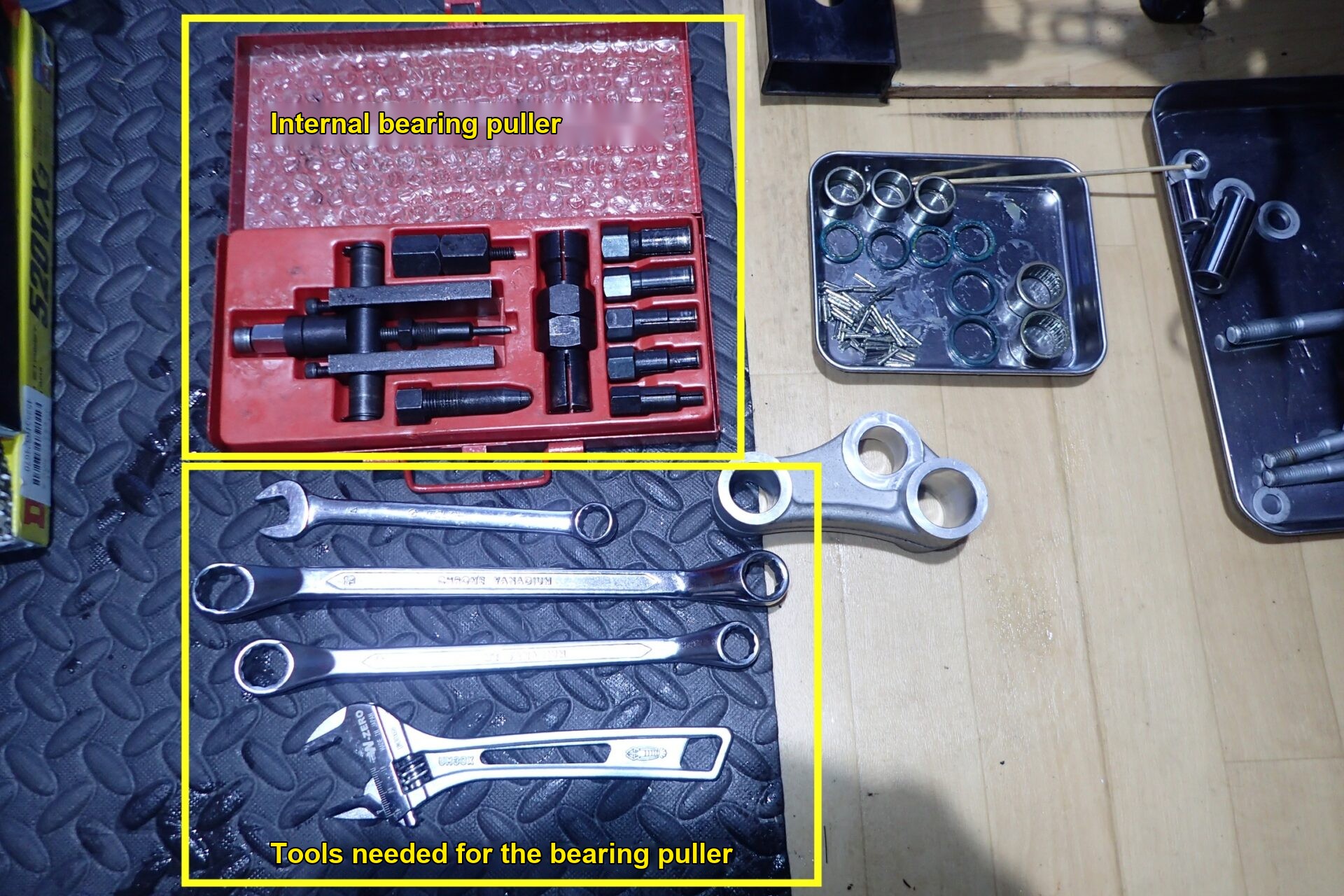 An internal bearing puller and the spanners (wrenches) needed to use it.