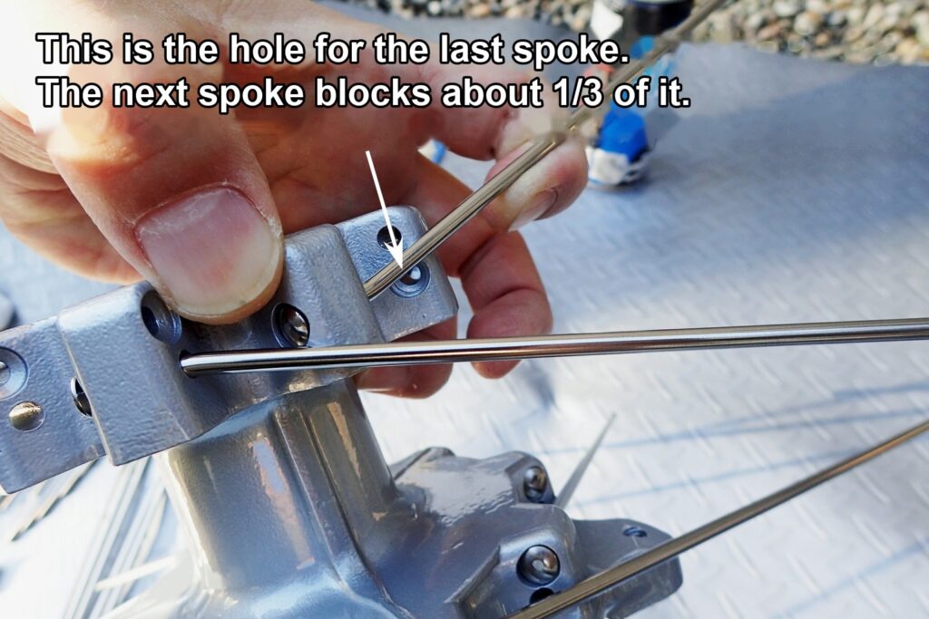 At this angle, the last spoke can't go into its hole because the neighbouring spoke is in the way